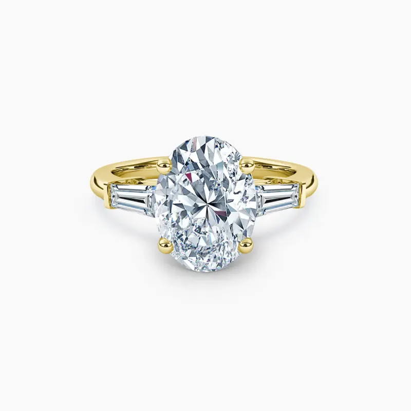 Three-stone, yellow gold